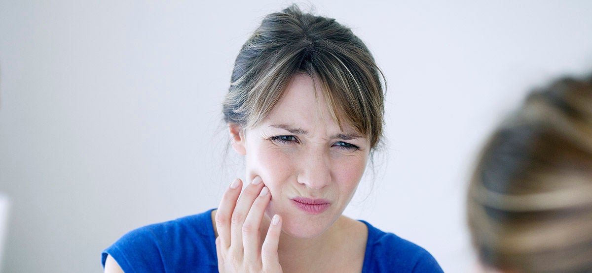 Woman with toothache.